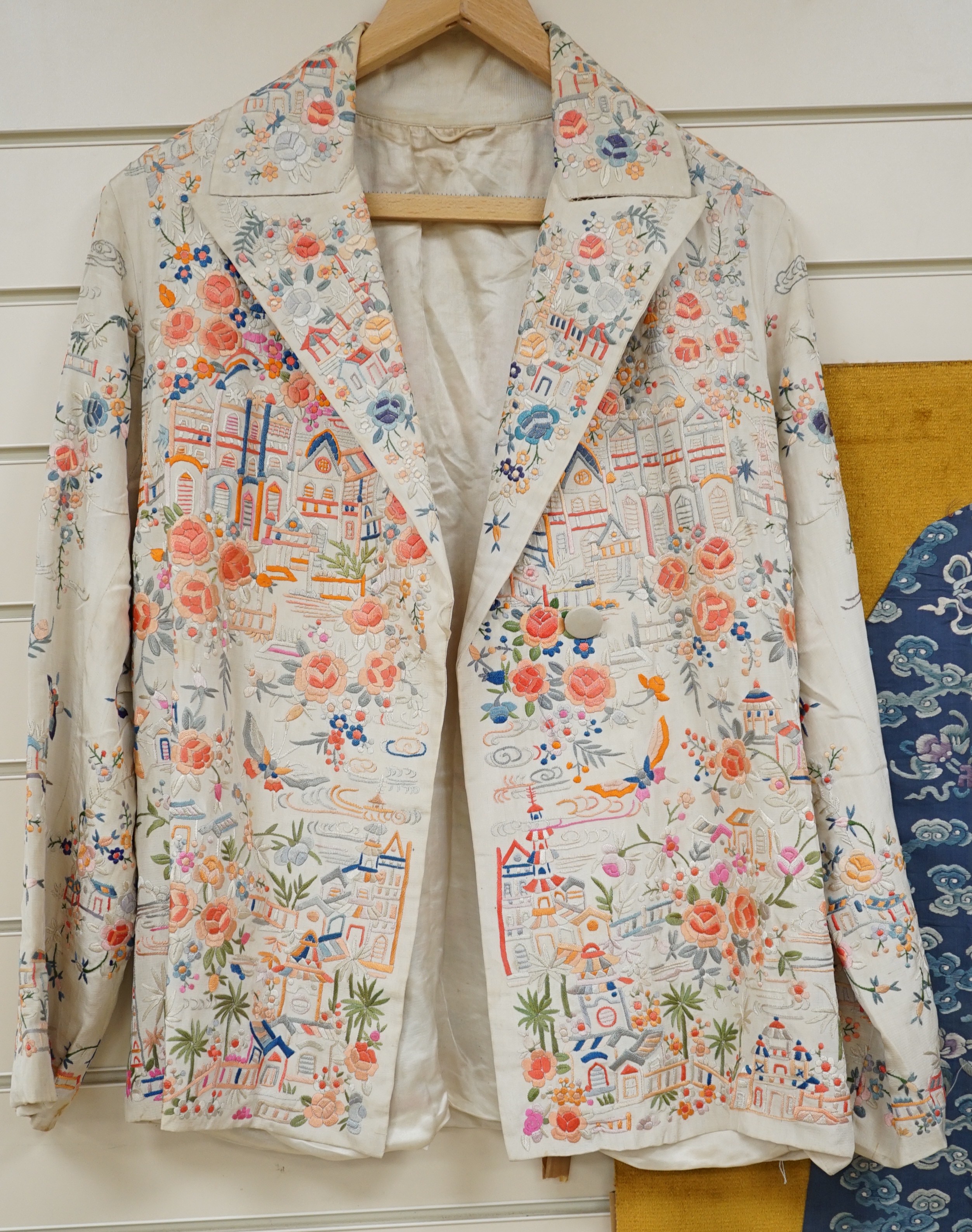 A Chinese 1930’s cream silk and multi coloured embroidered evening jacket